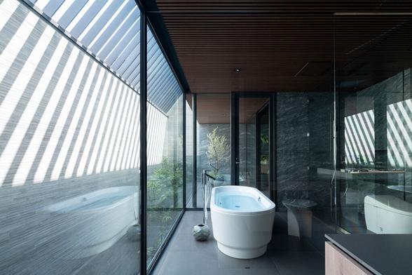 Stealth Is a Home Hidden Behind a Monolithic Facade in Tokyo
