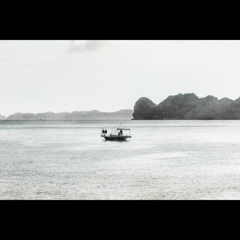 A fisherman boat in the Halong Bay, b&w photography,  Vietnam