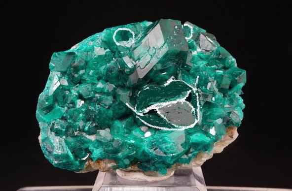 A brain shaped dioptase with as if a nose sticking out, and two eyes, with a mouth drawn in for further emphasis, along with the other features even more naturally there. The turquoise emerald colour piece now looks like a mischievous resident of Oz sticking its tongue out, or someone for TikTok Man or Ozma & co. to save from Mombi or all.