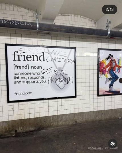 street graffiti on billboards in New York underground advertising for AI friend bots. Graffiti says 'Surveillance capitalism; get real friends'.