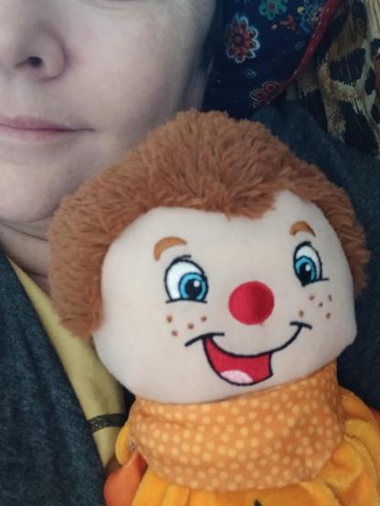 a mr tumble plushie next to the users face