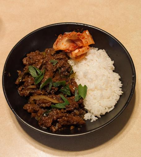 A picture of rather appetizing beef bulgogi, with rice and a bit of kimchi.