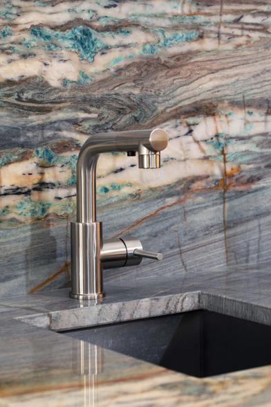 Blue kyanite-bearing rock forms the backsplash of a sink
https://primestones.com/blogs/kyanite-a-blue-gem/