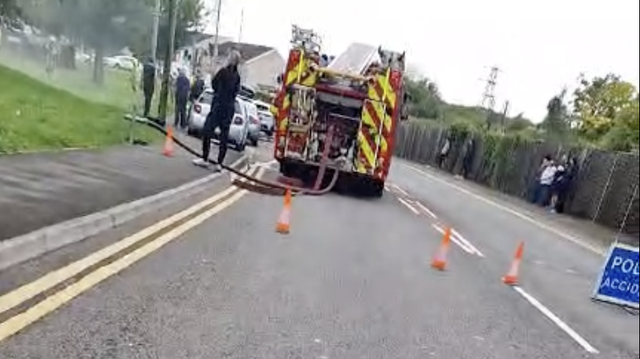 Emergency services close Furnace Terrace in Neath, with fire engines and police signs in place as crews respond to the ongoing house fire.