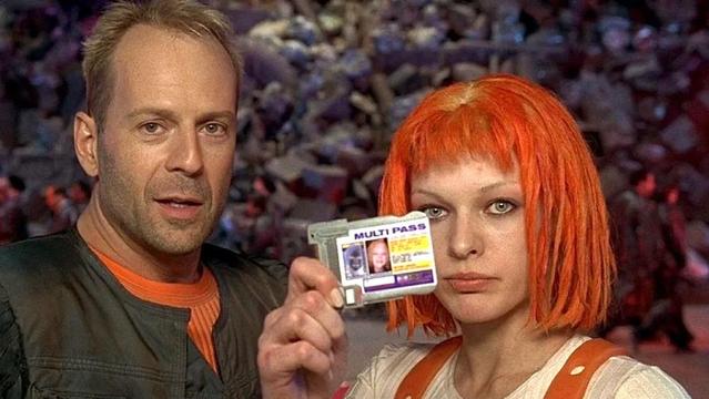 A photograph of Leeloo Dallas in the movie Fifth Element holding up her Multipass
