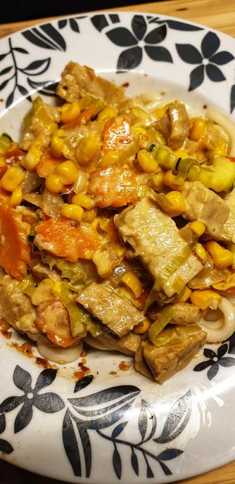 Tempeh & homemade Seitan Thai Green Curry served on Udon Noodles