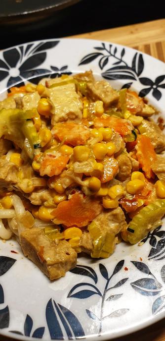 Tempeh & homemade Seitan Thai Green Curry served on Udon Noodles