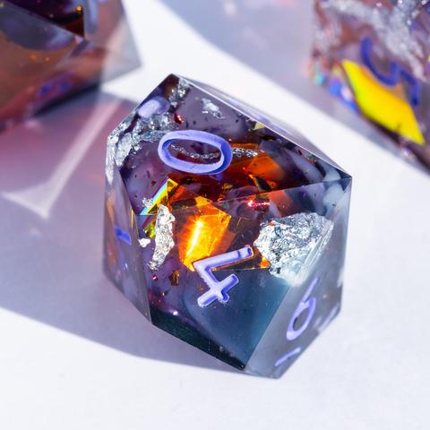 A D10 with purple swirls and orange reflective foil