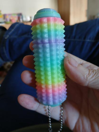 a rainbow colored little ouchies stimtoy