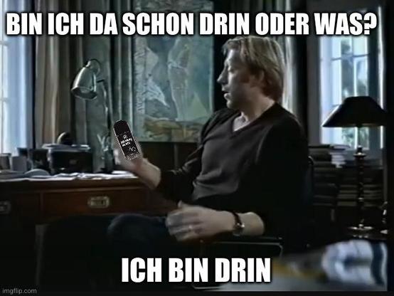 Meme referencing the famous 1999 German AOL commercial with tennis player Boris Becker. He is sitting at a desk, holding a Nitrokey FIDO2 hardware token instead of a laptop. The text above reads: “Bin ich da schon drin oder was?” (“Am I already in or what?”) and below: “Ich bin drin” (“I’m in”). It humorously connects the ad’s iconic catchphrase about getting online with the use of modern security tokens.