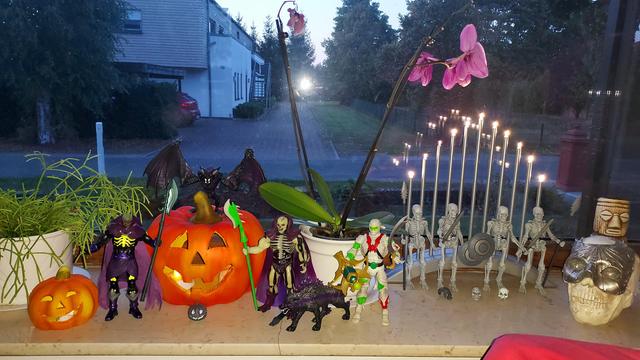 Masters of the Universe Classics Scare Glow and Wrap Trap, Masterverse Scare Glow, Mythic Legions Graveyard Skeletons, Schleich Eldrador Shadow Bat and Shadow Wolf, two illuminated pumpkins and a skull