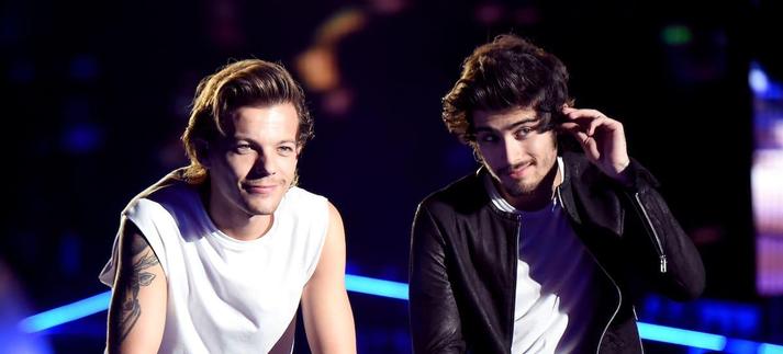 Louis Tomlinson y Zayn Malik, ex miembros de One Direction, durante un concierto de la banda en el tour 'Where We Are' en septiembre de 2014. / Jeff Kravitz/OneD