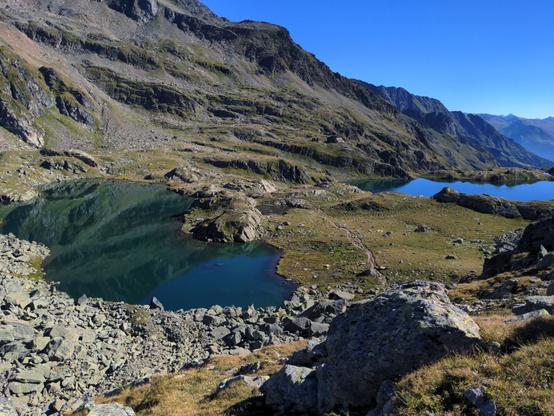 View from Unter Seescharte to Wangenitzseehütte and two clear water lakes in between.