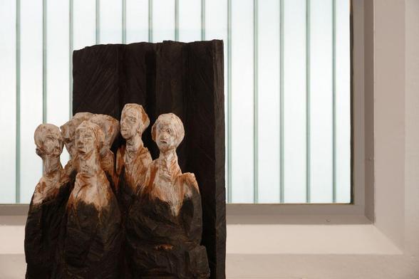 a group of sculptures in a window frame