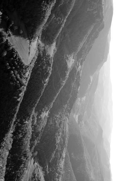 Fan, shaded by the distance, of the legs of the Causse Méjean. The image is rotated 90 degrees. (Version françæ) Éventail dégradæ par læ distance des pattes dal Causse Méjean. L’image est tournæ de 90 degrés.