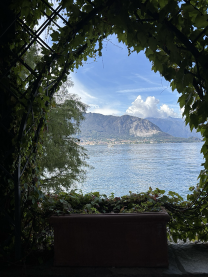 "Natural" window from the gardens of Isola Madre, view on one of the coastal villages of Lago Maggiore and its nearby mountains