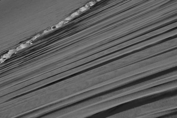 You can see the footpath in the left corner. The major part of the photo shows formation of sand who rolls down, blowing by the wind