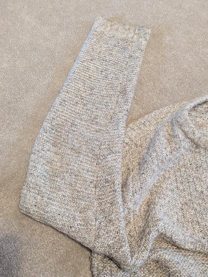2) A photo of the same jumper showing the seam all sewn up and functioning again. I used mattress stitch so you cannot see the repair.