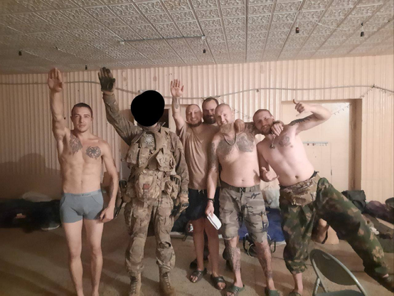 'Española’ soldiers posing with 'black suns' and other tattoos