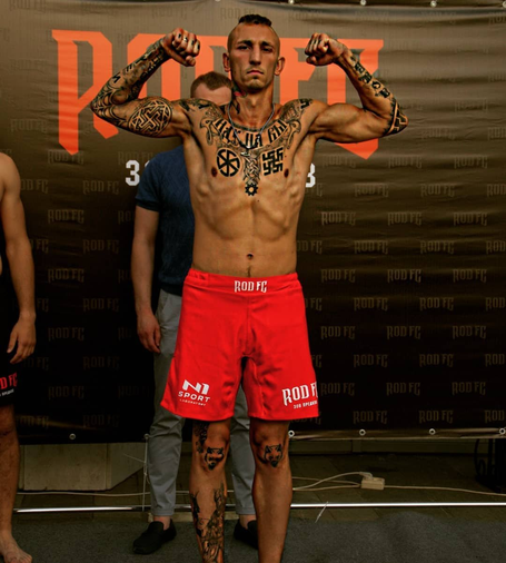 One of the main 'Española’ commanders Mikhail Turkanov proudly displaying swastikas, black suns and other tattoos