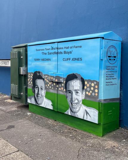 Utility box mural in Sandfields featuring Swansea City football greats Terry Medwin and Cliff Jones, celebrating the club’s Vetch Field era.