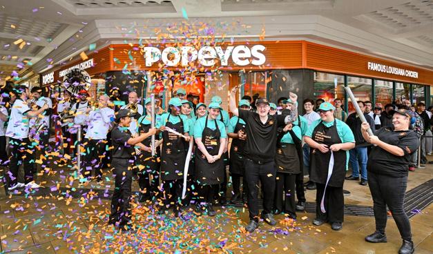 Crowds outside the new Popeyes restaurant on Oxford Street, Swansea, during its opening day on 3 October 2025.