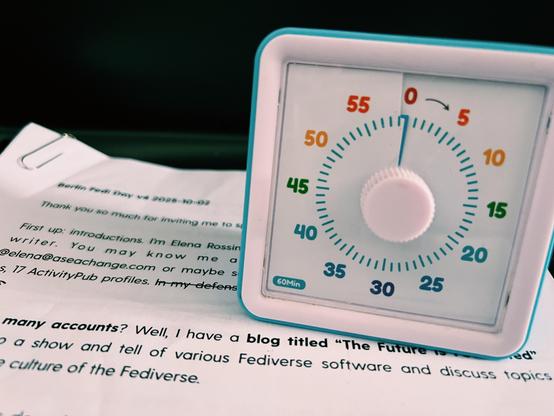 A photo I took on the plane showing my visual alarm over a print out of my presentation