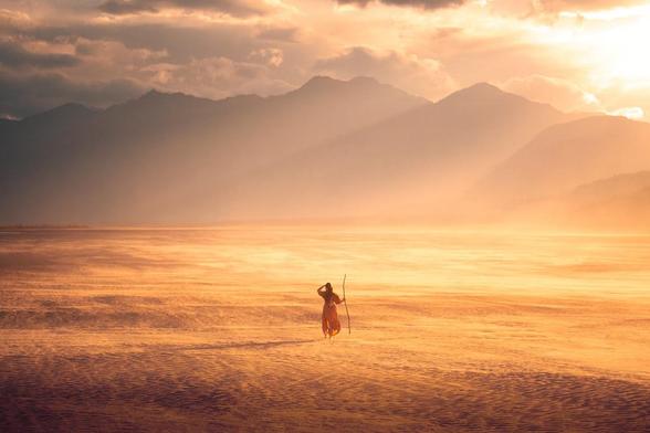 Would you believe this epic windblown sandy desert valley place is in the Yukon? At the end of summer, I spent a month living out of my car and camping in the mountains up in northern Canada, and I was honestly blown away by the diversity of the landscapes. From snow-capped peaks and glaciers, to jagged black spiky mountains, volcanic lands where I swear dragon still live, to thousands of miles of endless tundra and boreal forests… to dry, sand-filled deserts?!

I was not expecting to stumble upon this place in my time up north, but wow, am I glad I did. I may have gotten totally sand-blasted in the wind for this photo (…and for days after I was literally finding sand *everywhere*, ha!) - but it was so worth it, running around like a kid who found a cool stick and became a wise wizard and decided to embark on a magical quest across the desert lands to the far off mountains and into the sunset.

Yep, it’s in these silly, beautiful moments that I become filled with gratitude and realize… the adventure-filled storybook life I used to always live in my imagination? I’m living it now.  We can choose to live it now.  One beautiful, childlike, sand-filled adventurous moment at a time.