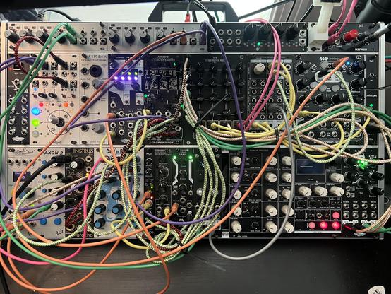 A modular synth with patch cables.