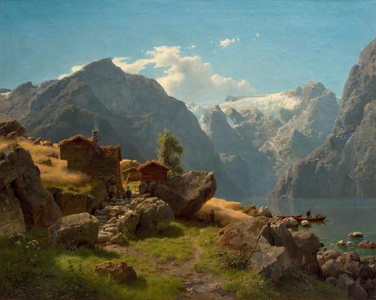 Late summer morning in a fjord landscape with a small settlement surrounded by rocks and small golden fields reaching down the hill until the shore line. Two children are standing in the shade on a small path leading between the wooden houses, roofs covered with grass and moss. Massive mountain peaks with near vertical slopes in the background. A large glacier on one of them. Bright hazy day with light reflecting on individual blades of grass, leaves, presumably still covered in dew.