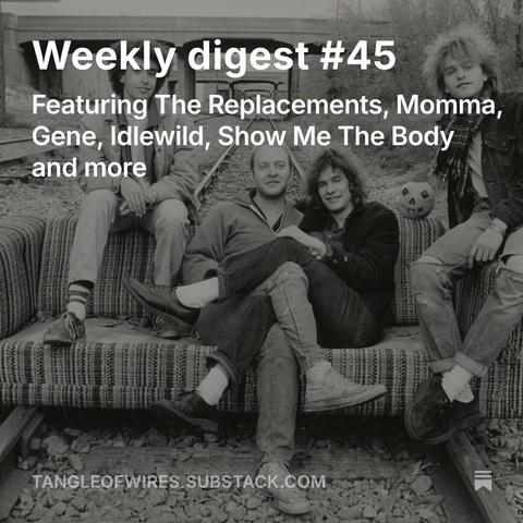 The Replacements sat on a couch placed on train tracks