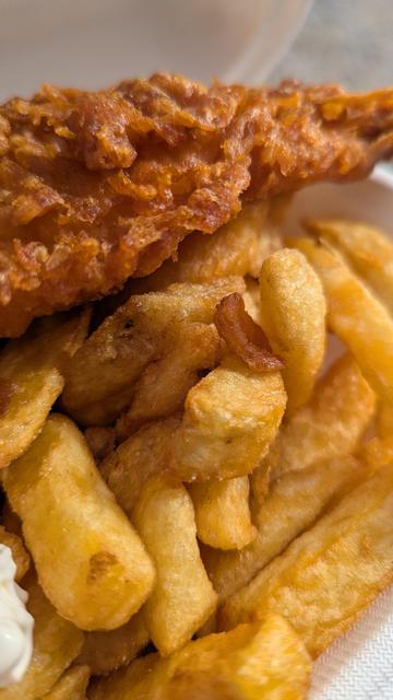 A close up of a very good fish and chip, very well done chips and the batter on the fish was very crispy