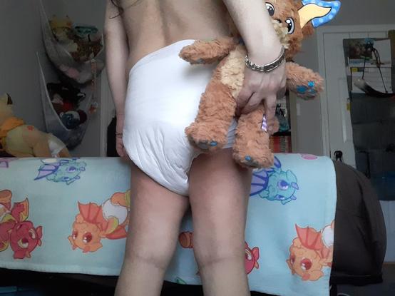 Friar holding Patches plushie from behind