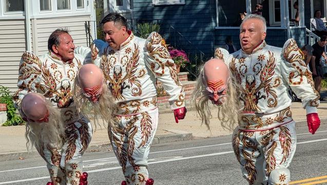 Bolivian dancers after taking off their costume heads