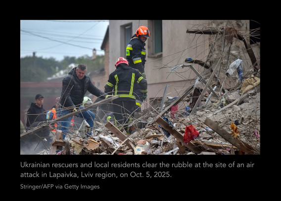Aid workers in Ukraine clean up after Russian bombardment. Ukrainian rescuers and local residents clear the rubble at the site of an air attack in Lapaivka, Lviv region, on Oct. 5, 2025. AFP.