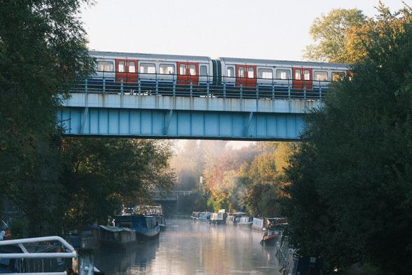 Foggy morning on the canal with an Overground train on the  bridge.