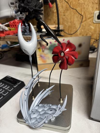 The piece of the Hornet model on magnetic alligator clips after base coloring.