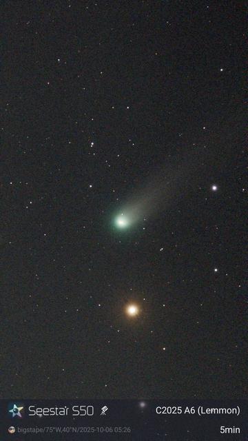 A greenish comet above a yellow star