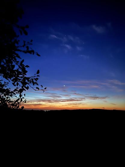 Again, it’s too dark for me to see much. To my eyes I can’t see the pastures and hills and trees and shrubs. The sky looks fairly dark. The stars are pretty bright, but the sky is lightening near the horizon. I see the lights in Alliston over the hill had a barn light at the next line. But I can hear farmers working through the night to #combine their crops.