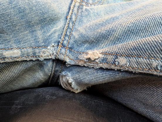close up view of worn crotch of Levi's jeans.