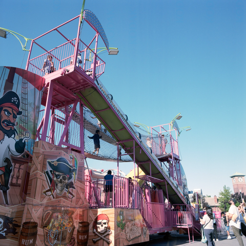 There be pirates! A pirate ship themed slide, accessed by a plank bridge, in the kids’ midaway.