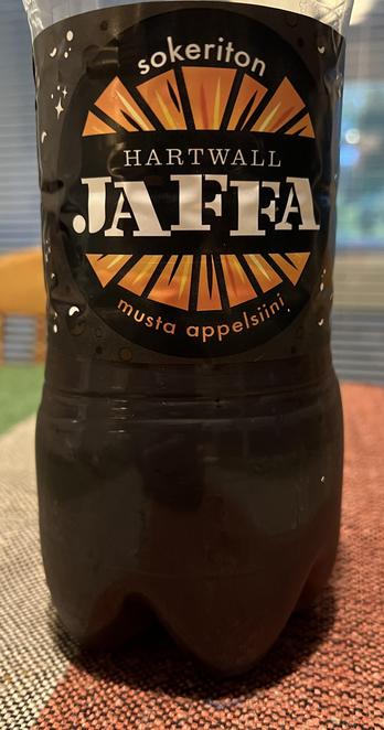 Half-consumed bottle of Finnish ”Jaffa” orange-cola