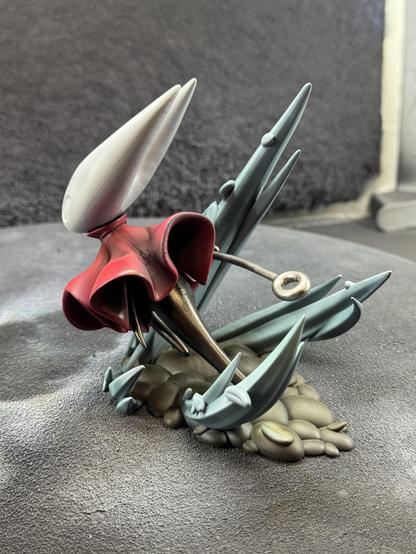 A 3d printed figure of Hornet from the game Hollow Knight Silksong. After airbrushing more shading and colors. The model is shown from the back.