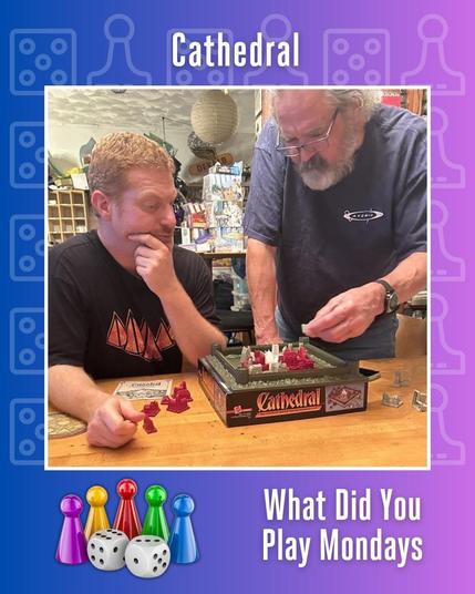 Cathedral written above a photo of Tim and Alex playing the Cathedral board game on a wooden tabletop with games and household decor in the background and 5 colored pawns and two white dice below next to What Did You Play Mondays on a blue to purple ombre background with light dice and pawn outlines