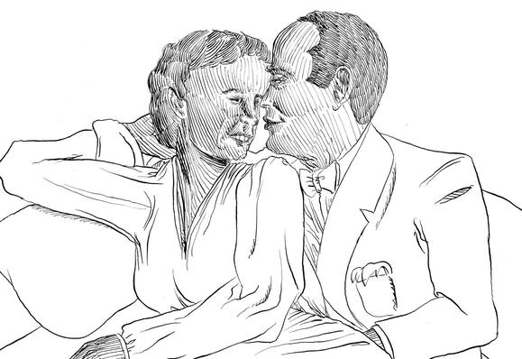 A man and a woman kiss each other