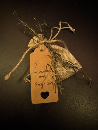 Sachet with lavender and sage tied together with twine, decorated with dried rosemary.