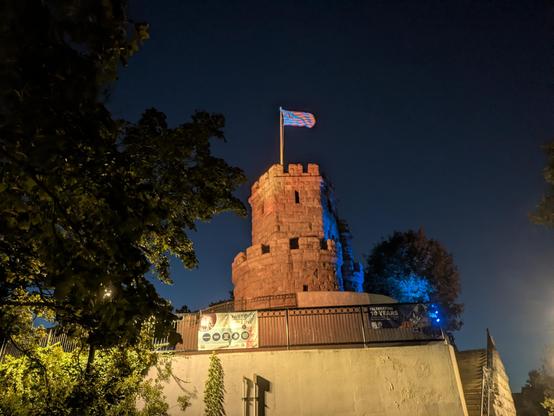 a wide view of the Prospect Hill Tower with a Continental Union Flag atop it (the first American flag)