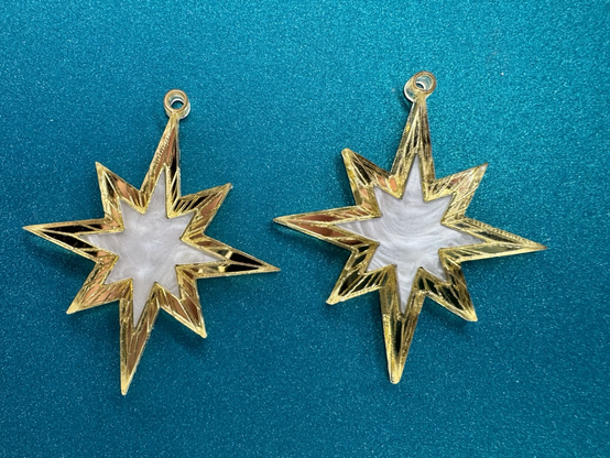 laser cut acrylic earrings. angelic stars outlines in engraved gold mirror.