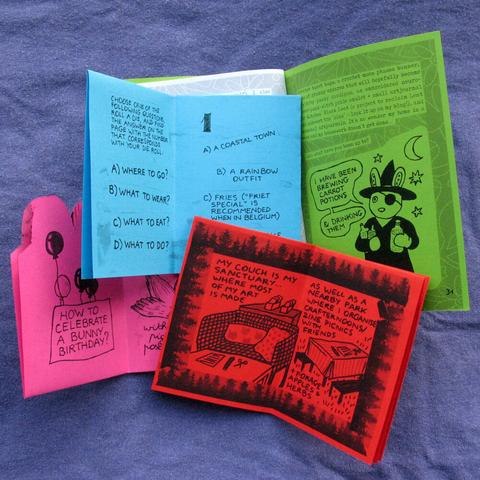 The same 4 zines, each opened to show two pages from the inside, and partly laying on top of each other.