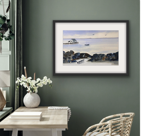 Framed art shown in a display room.